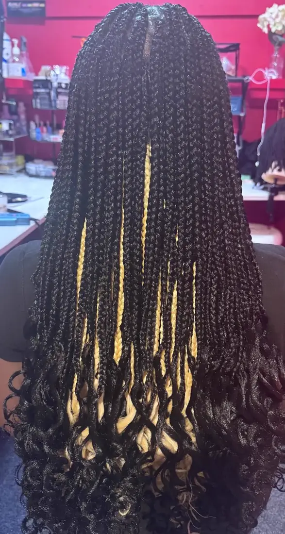 Long knotless braids with blonde highlights