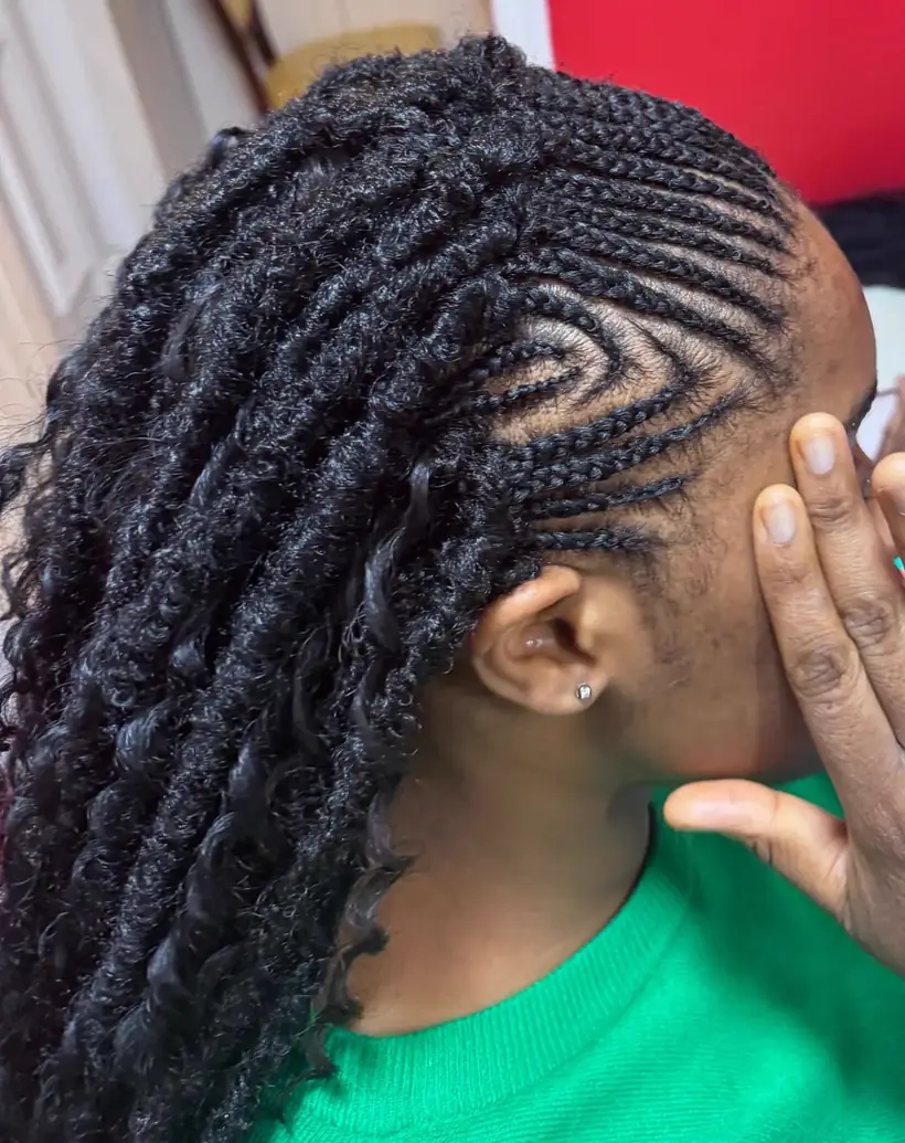 Side profile stitch cornrows with loose curls