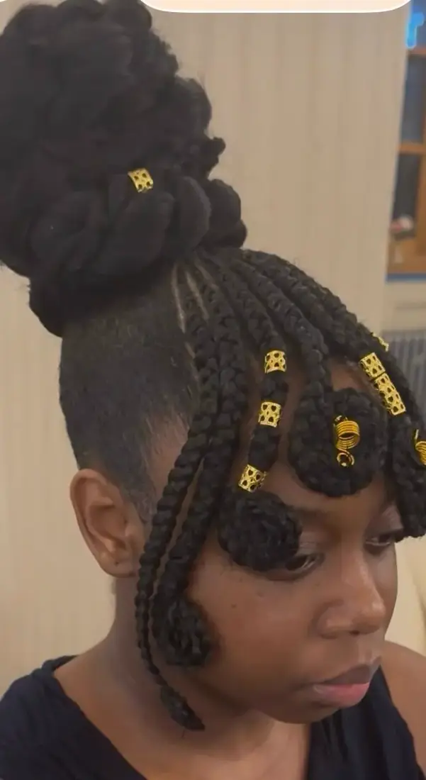 High bun braids with gold cuffs styled in Aberdeen
