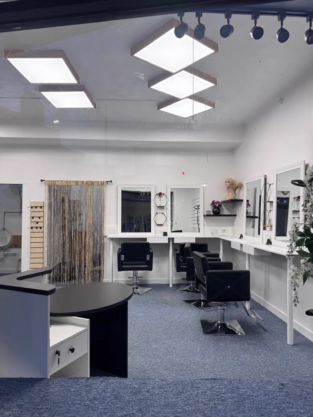 ONOMZ Beauty Salon Aberdeen interior showing the reception desk and mirrored styling area